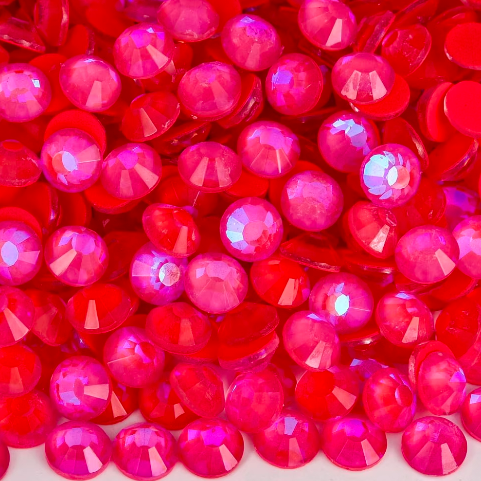 A screenshot of an online store listing showing a close-up photo of many round, faceted pink rhinestones. The listing text mentions Luminous Siam Glass Rhinestones